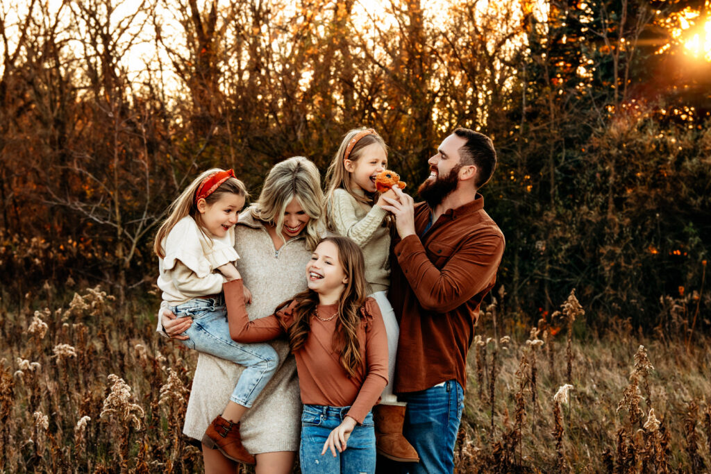 Family photoshoot in highlighting their fall outfits