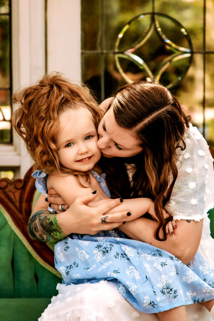 Mother and daughter wearing soft blue and white spring outfits that match the Petal & Periwinkle photoshoot color palette - taken by Metro Detroit Photographer, Stefaney Dawn Photography